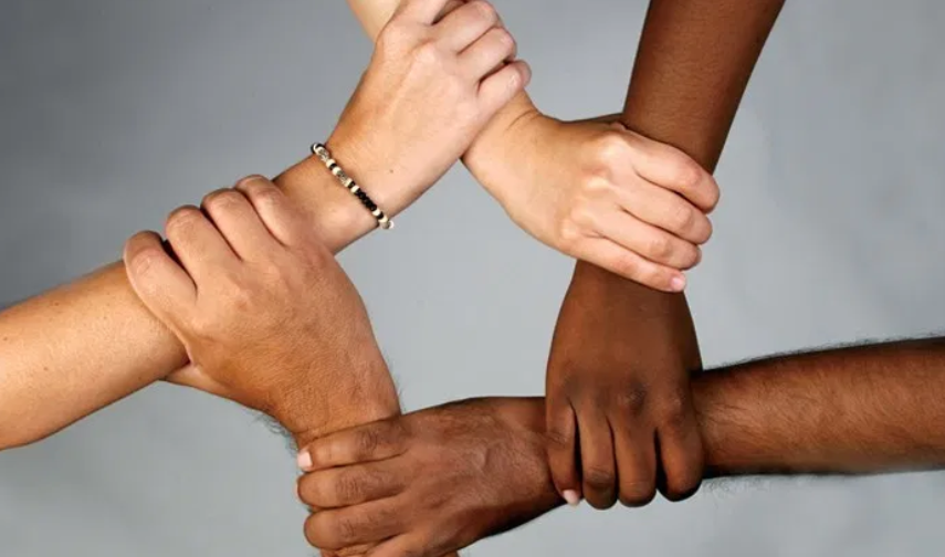 Diverse hands forming a square – representing unity, inclusion, and community support