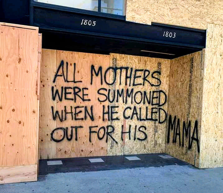 Graffiti reading ‘All mothers were summoned when he called out for his mama’ – a powerful message about empathy and maternal solidarity.
