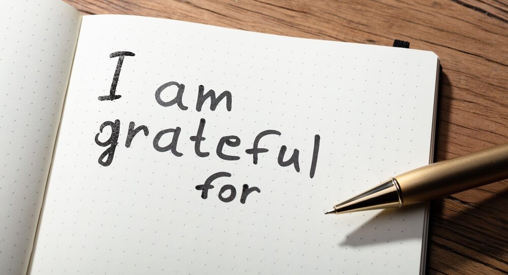 Open gratitude journal with pen – cultivating thankfulness and emotional well-being